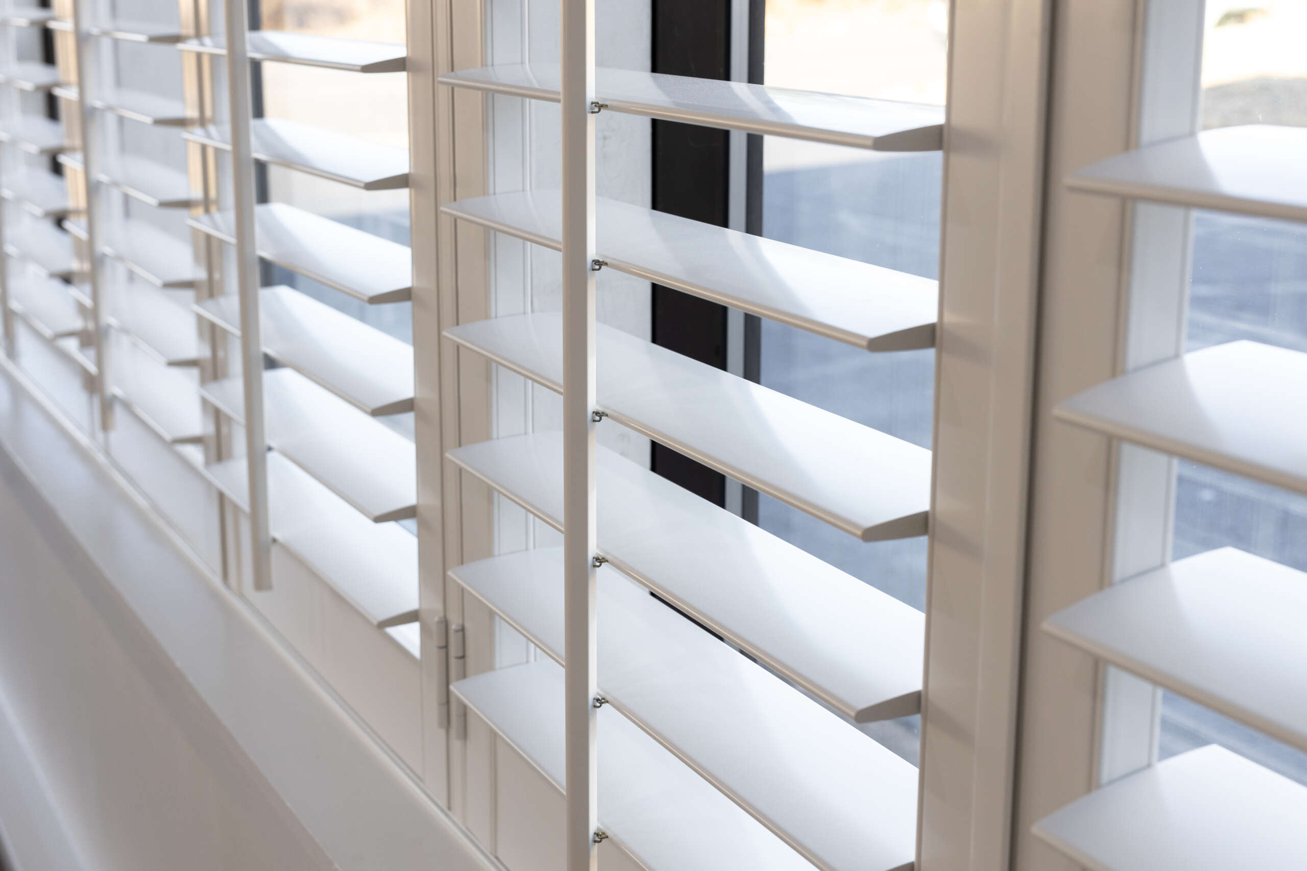 Close-up of white interior shutters